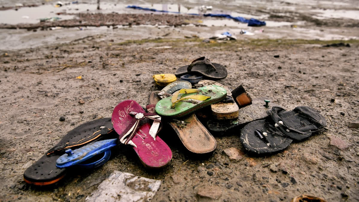 Footwear seen scattered at the Hathras stampede incident site on Wednesday, day after 121 people were killed during a ‘Satsang’.