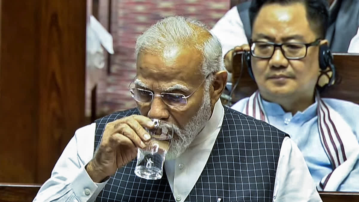 Prime Minister Narendra Modi sips a glass of water as he speaks in the Rajya Sabha on the Motion of Thanks to the President's Address, in New Delhi on Wednesday.