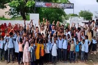 VILLAGERS PROTEST BY LOCKING SCHOOL