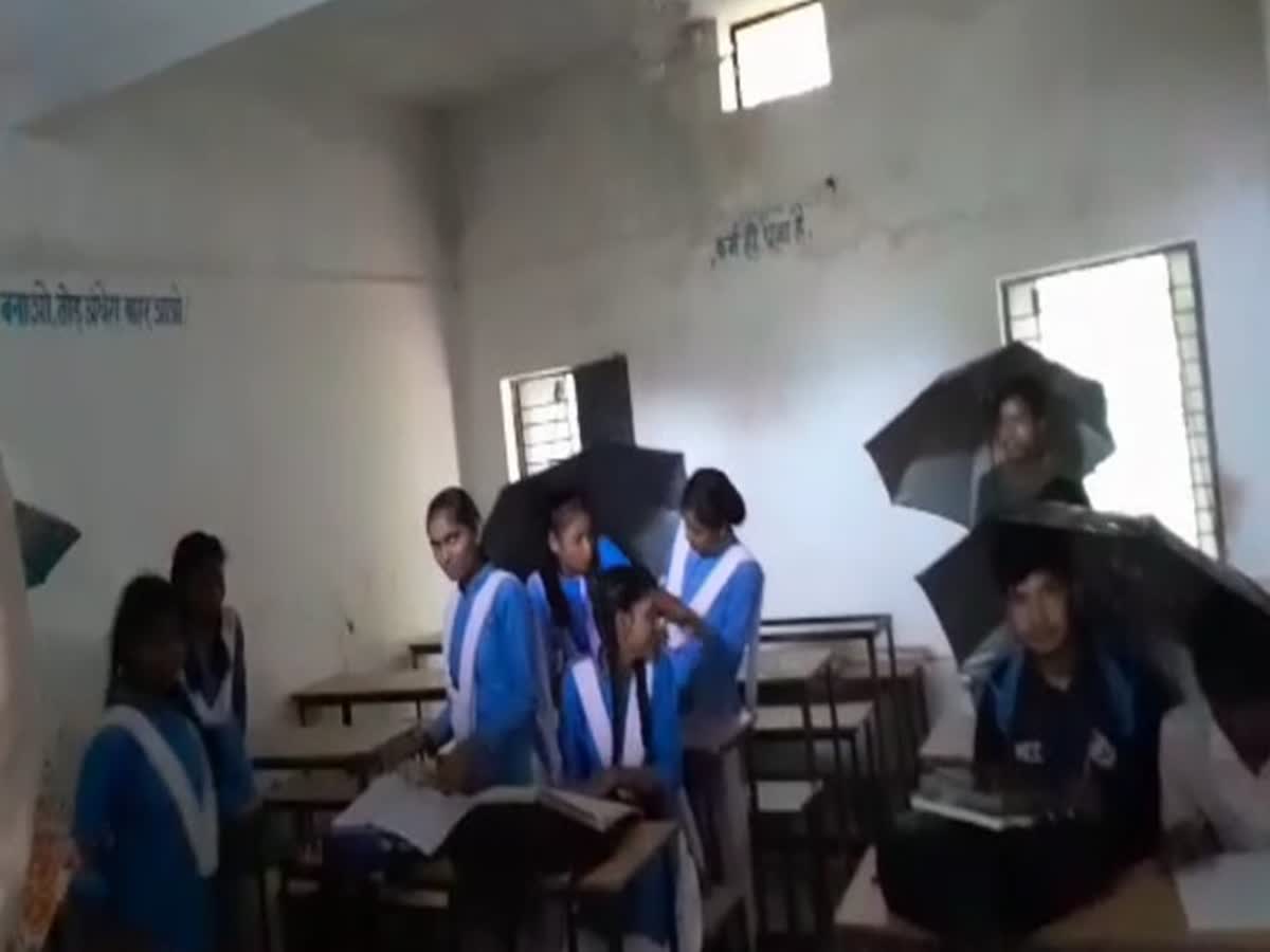 In this MP school, students have to use umbrellas, raincoats in the  classroom, madhya-pradesh-students-at-this-shahdol-school-must-carry- umbrellas-raincoats-on-rainy-days-due-to-broken-roof