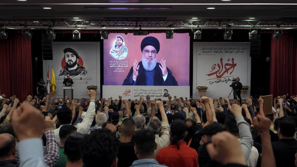 Supporters of the Iranian-backed Hezbollah group listen to a speech by Hezbollah leader Sayyed Hassan Nasrallah