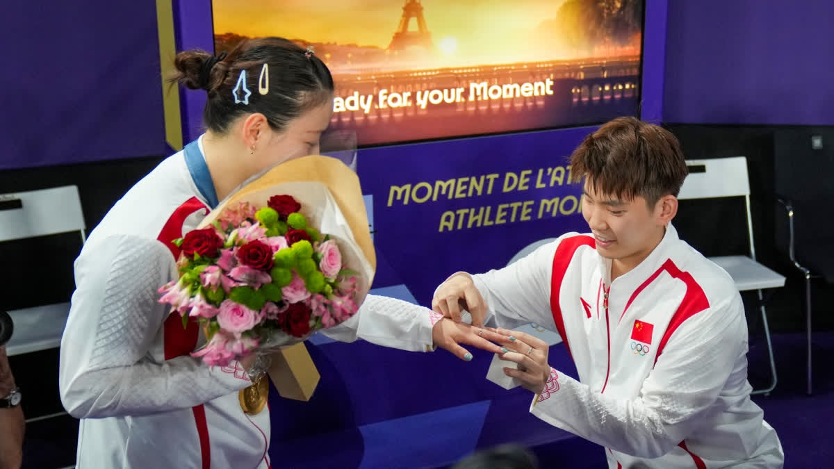 Chinese shuttler Liu Yuchen got down on his knees and proposed to his girlfriend and Paris Olympic gold medalist shuttler Huang Yaqiong as the crowd started chanting 'Yes' asking her to accept the proposal on Friday.