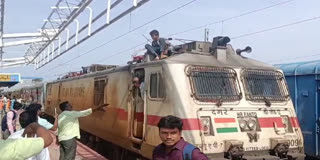 BOY CLIMBING IN TRAIN TOP