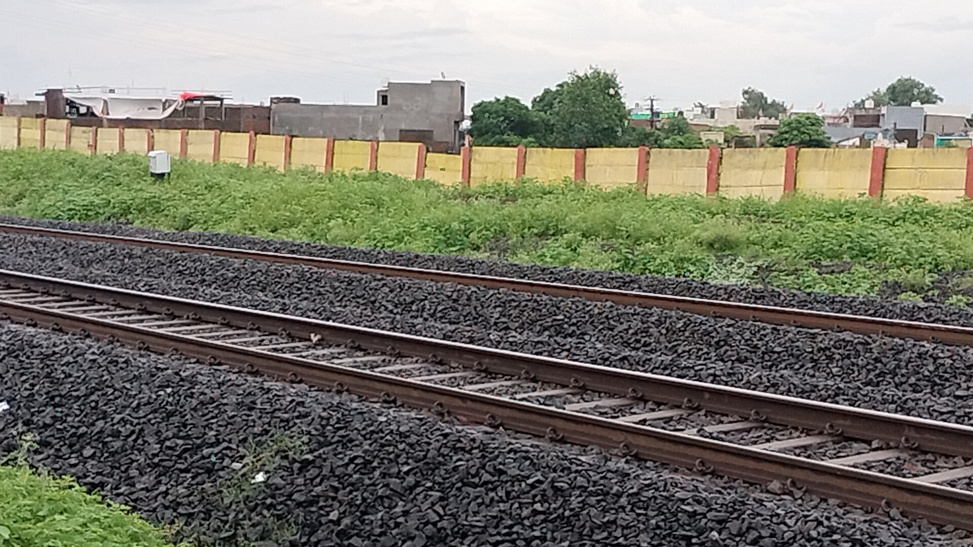 boundary wall built railway track