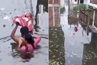 Parents Carry Baby In Floods
