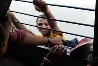 hanged thief on window of a moving train