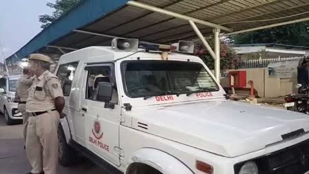 Delhi Police personnel stand guard