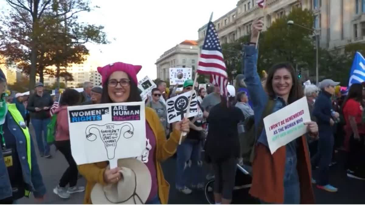 Women's march protesters gather to support Vice President Kamala Harris