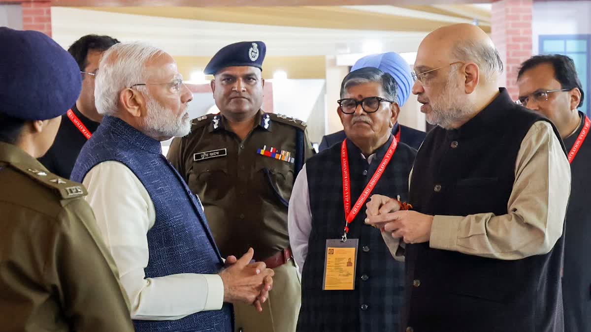 Prime Minister Narendra Modi and Union Minister for Home Affairs and Cooperation Amit Shah during an exhibition on the implementation of new criminal laws, in Chandigarh on Tuesday. Punjab Governor Gulab Chand Kataria is also present.