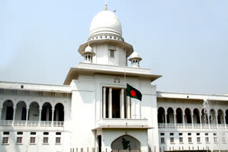 The Bangladeshi national flag is seen flown at half-mast outside the High Court building in Dhaka