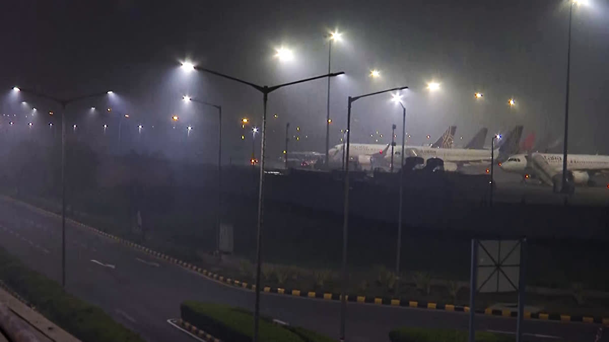 Dense fog covers the Indira Gandhi International Airport on a cold winter morning, in New Delhi