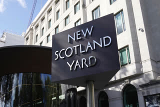 FILE - A sign stands in front of the New Scotland Yard, the headquarters of the London Metropolitan Police, in London, Monday, Sept. 25, 2023.