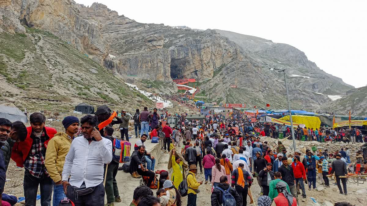 Pilgrims wait in a queue to offer prayers at the Amarnath Temple during an annual Hindu pilgrimage to the Amarnath yatra, on Wednesday, July 3, 2024