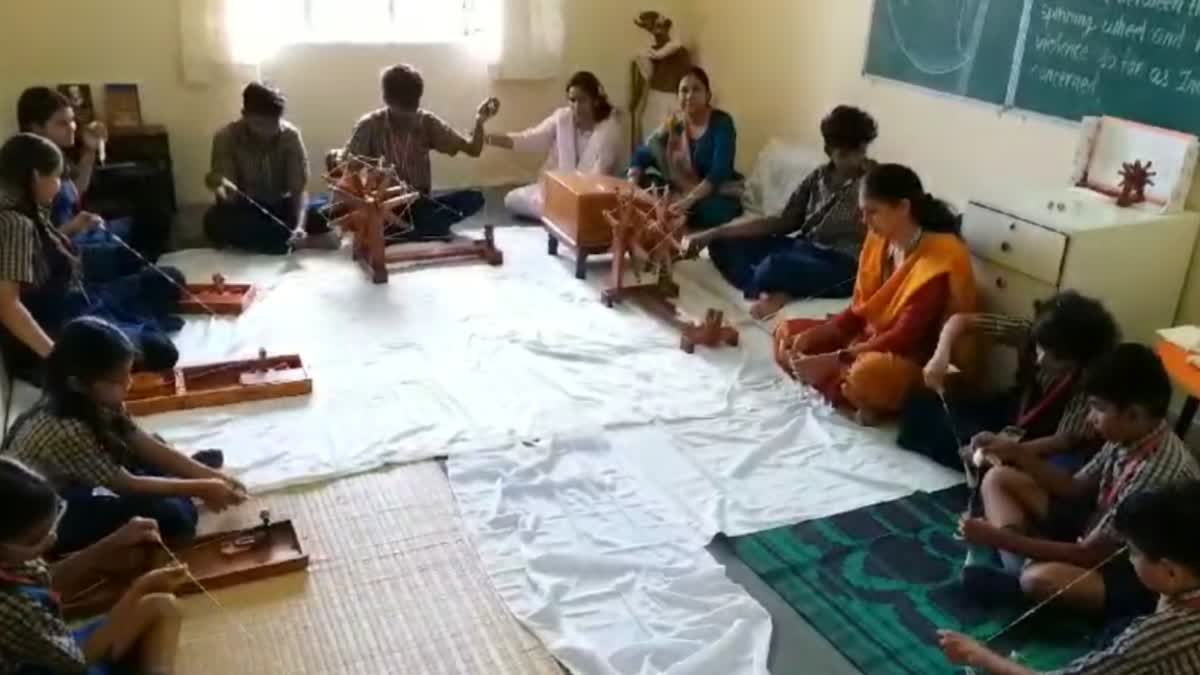 children spinning Charkha