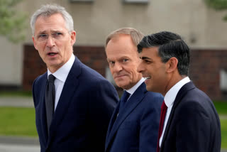 Britain's Prime Minister Rishi Sunak, right, Poland's Prime Minister Donald Tusk, center, and NATO Secretary General Jens Stoltenberg, right, visit the Armourd Brigade barracks in Warsaw, Poland, Tuesday, April 23, 2024.