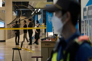 Man rams car onto sidewalk in South Korea and stabs people; at least 14 hurt