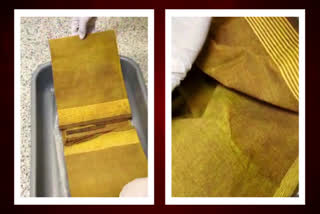A flier who was smuggling gold from Dubai to Hyderabad was caught by customs officials at Shamshabad airport. During the checking, officials found that 461 grams of gold hidden inside the Saree.