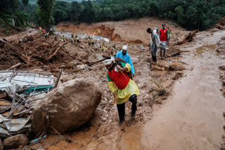 Rescuers make their way to the upper regions as they search through mud and debris for a third day after landslides set off by torrential rains in Wayanad district of Kerala on August 1, 2024