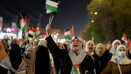 Women chant slogans while waving Palestinians flags during a rally in Baghdad, Iraq, on Saturday, Aug. 3, 2024, to show support for Palestinians in Gaza and to condemn the killing of Hamas leader Ismail Haniyeh in Iran.