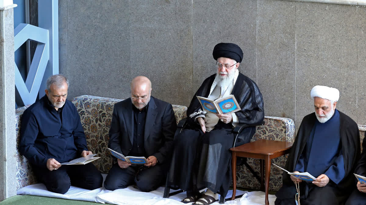 In this photo released by the official website of the office of the Iranian supreme leader, Supreme Leader Ayatollah Ali Khamenei, second right, Judiciary Chief Gholam Hossein Mohseni Ejehei, right, Parliament Speaker Mohammad Bagher Qalibaf, second left, and President Masoud Pezeshkian read Quran in a ceremony commemorating slain Hezbollah leader Hassan Nasrallah, at Imam Khomeini grand mosque in Tehran, Iran, Friday, Oct. 4, 2024.