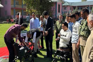 DC Anantnag Syed Fakhruddin Hamid during a wheelchair distribution program