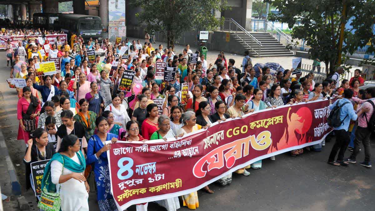 Women activists participate in a protest rally during their march to the CGO Complex in Kolkata on Monday