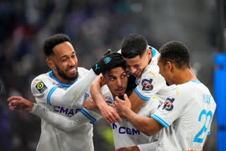 Paris Saint-Germain beat Le Havre 2-0 comprehensively to reach the top of the French league points table on Sunday despite playing with one player short for more than 80 minutes after goalkeeper Gianluigi Donnarumma was sent off for a reckless tackle.