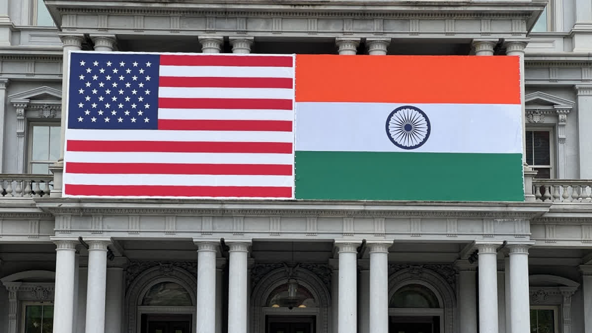 Flags of India and US adorn the Eisenhower Executive Office Building of the White House in Washington, DC