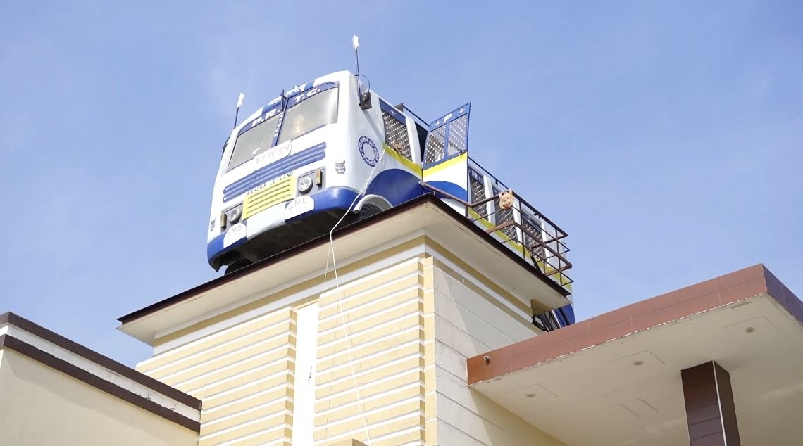 Bus On House Roof