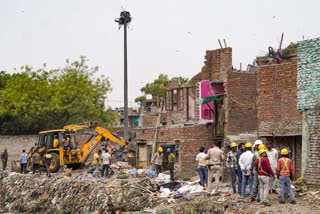 Anti enchoarchment drive underway in Taimur Nagar of South Delhi on Monday.