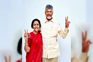 Telugu Desam Party (TDP) Chief N Chandrababu Naidu poses for a picture with his wife Nara Bhuvaneshwari as he celebrates after his party registers sweeping victory in the Andhra Pradesh Assembly elections, at his residence, in Amaravati on Tuesday, June 4