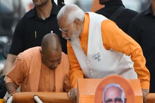Prime Minister Narendra Modi with Uttar Pradesh Chief Minister Yogi Adityanath holds a roadshow for the Lok Sabha elections, in Varanasi on Monday. PM Modi is the sitting MP and candidate from Varanasi.