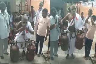 Saint Lifting Two Cylinders With Beard