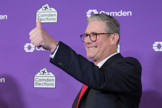 Britain's Labour Party leader Keir Starmer gives a thumbs up to his supporters after he was elected for the Holborn and St Pancras constituency, in London, on Friday,