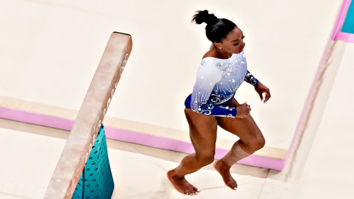 SIMONE BILES SLIPS OFF