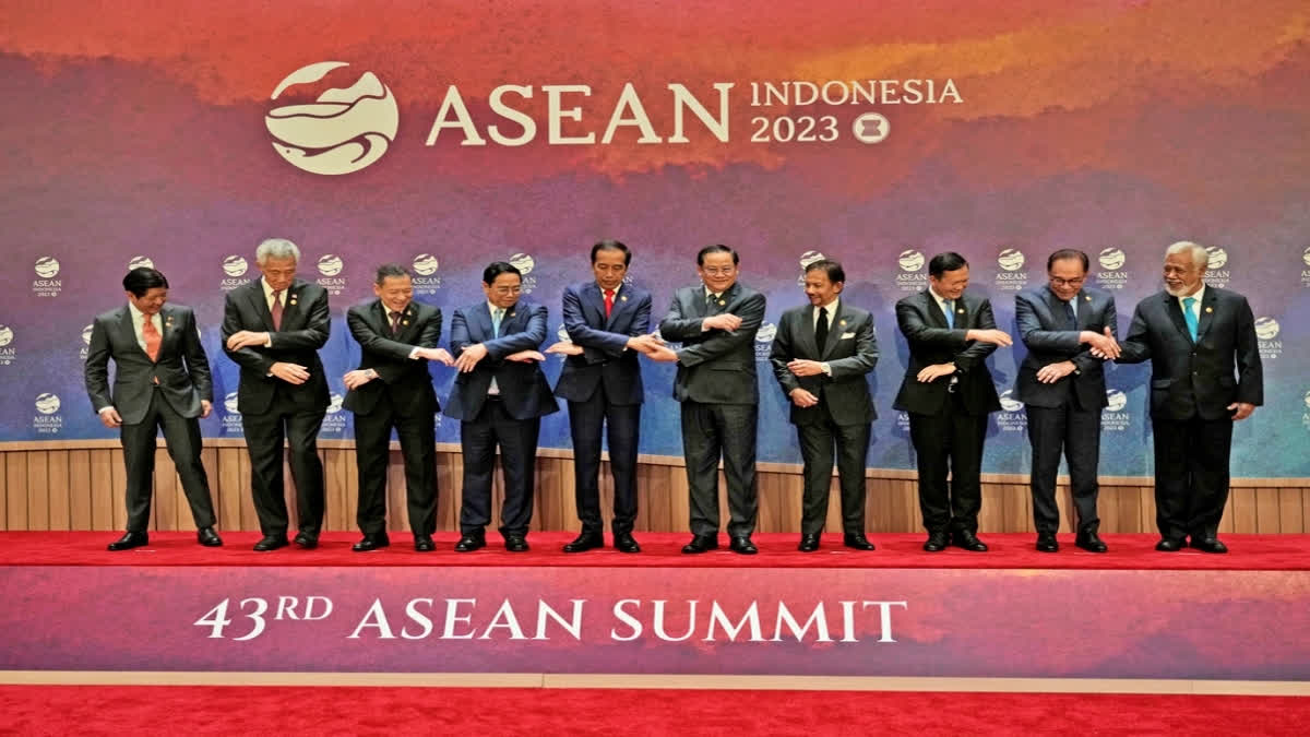 From left to right, Philippine's President Ferdinand Marcos, Jr., Singapore's Prime Minister Lee Hsien Loong, Thailand's Permanent Secretary of the Ministry of Foreign Affairs Sarun Charoensuwan, Vietnam's Prime Minister Pham Minh Chinh, Indonesian President Joko Widodo, Laotian Prime Minister Sonexay Siphandone, Brunei's Sultan Hassanal Bolkiah, Cambodia's Prime Minister Hun Manet, Malaysian Prime Minister Anwar Ibrahim, and East Timor's Prime Minister Xanana Gusmao hold hands for a family photo before the start of the retreat session at the Association of Southeast Asian Nations (ASEAN) Summit in Jakarta, Indonesia, Tuesday, Sept. 5, 2023. (AP Photo)