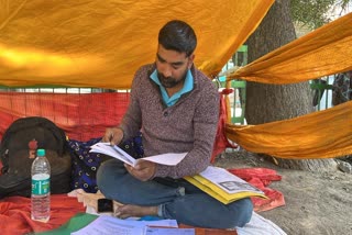 man sitting on dharna outside DC office Dhalpur