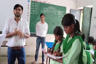 Two Engineers teaching English to children in Bokaro