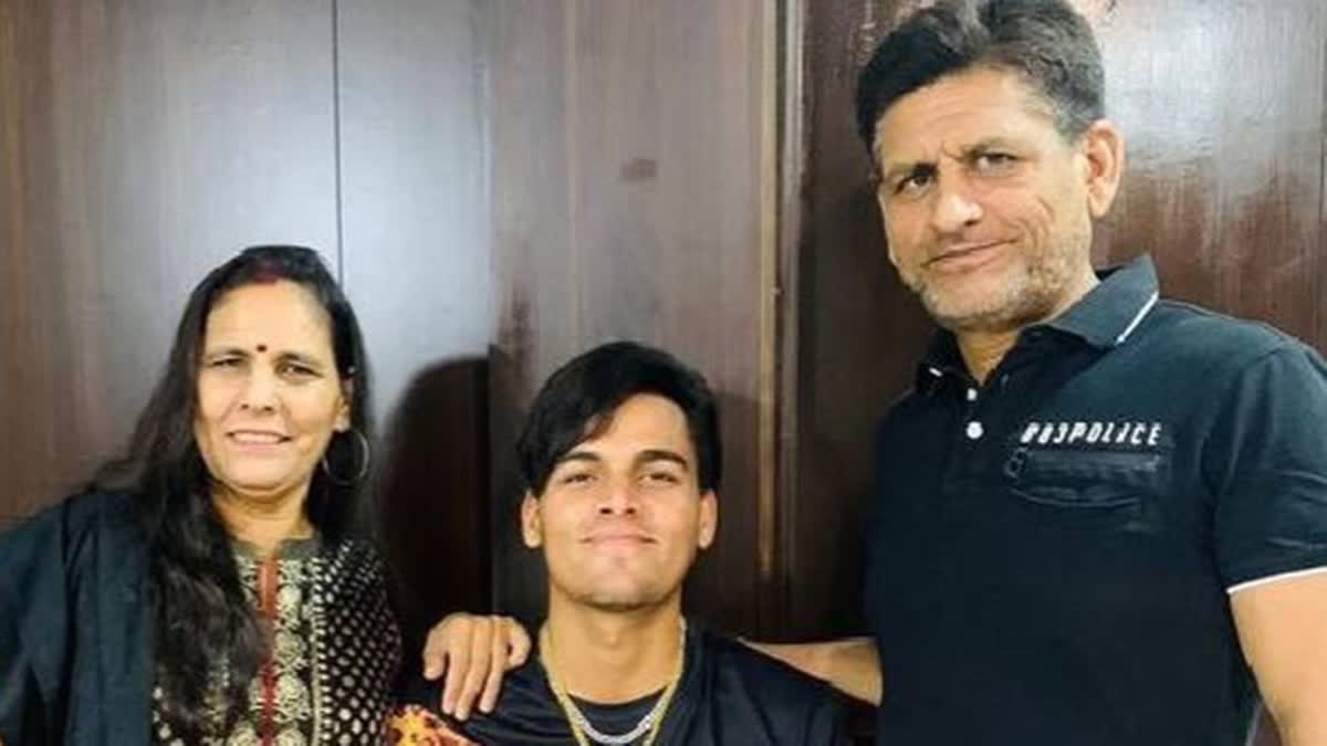 Cricketer Rahul Chahar (M) with parents