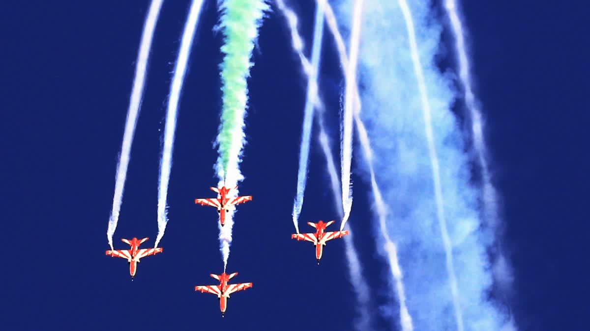 Indian Air Force (IAF) Sukhoi Su-30MKI fighter jets releases flares as it performs during a rehearsal for the upcoming IAF Day, at Marina beach in Chennai on Tuesday.