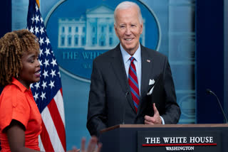 President Joe Biden, accompanied by Press Secretary Karine Jean-Pierre, makes a joke as he speaks at the top of the daily press briefing, Friday, Oct. 4, 2024, at the White House in Washington.