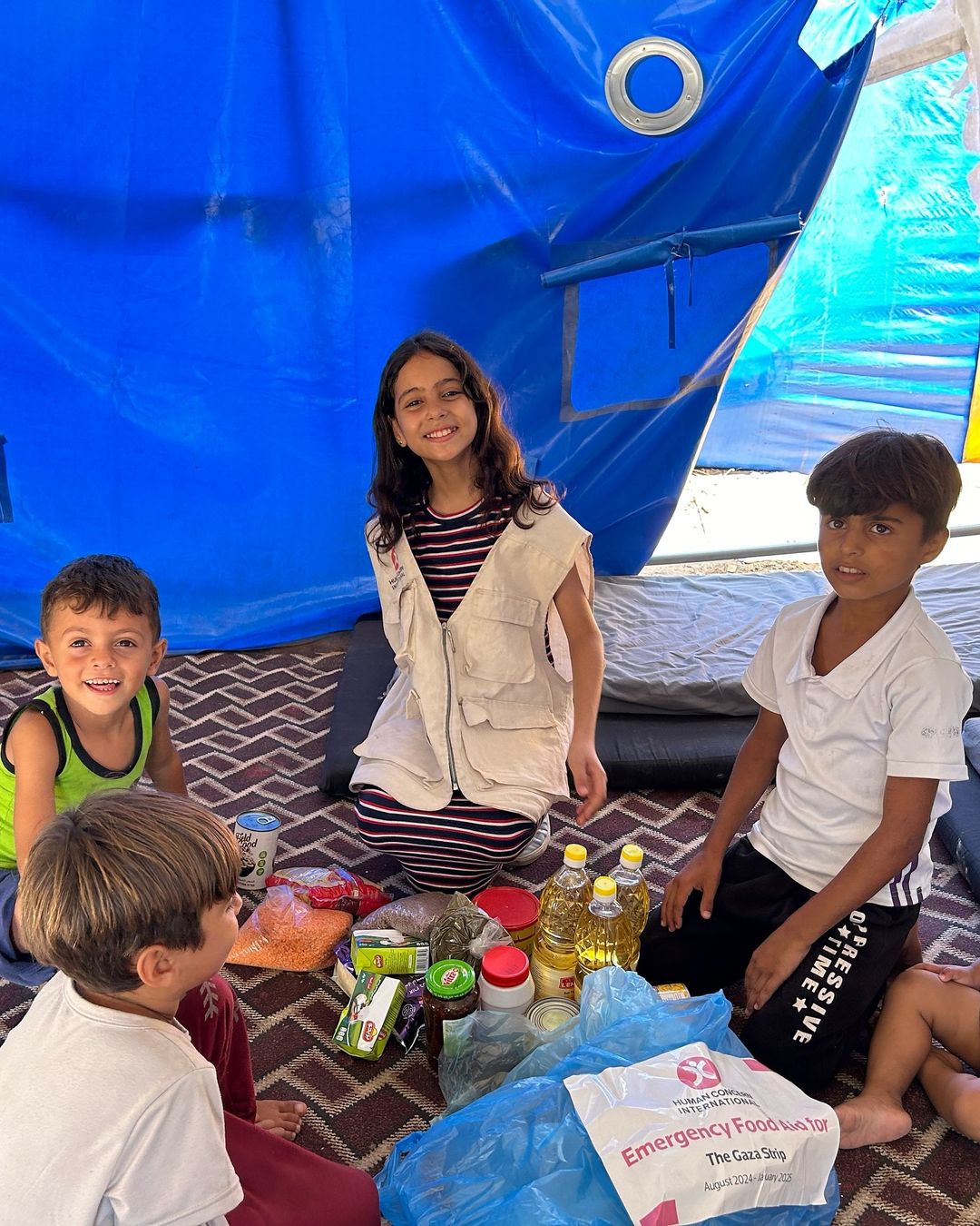 Renad Ataullah with other children in a refugee camp