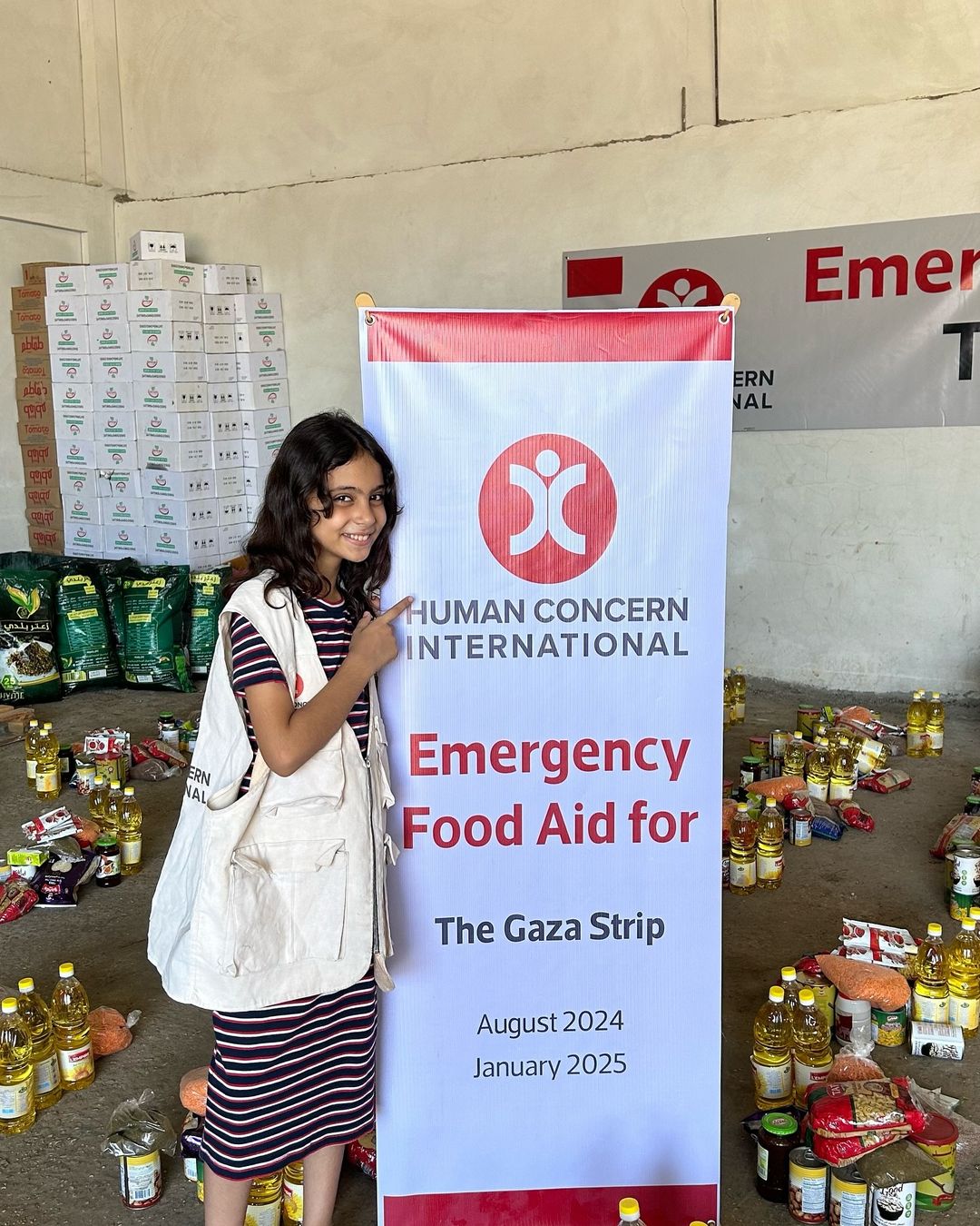 Renad Ataullah running a food aid