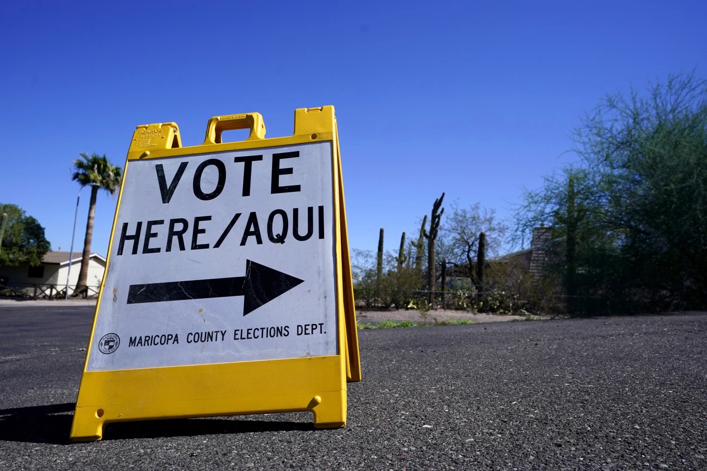 File - A sign marking the entrance to a voting precinct. AP