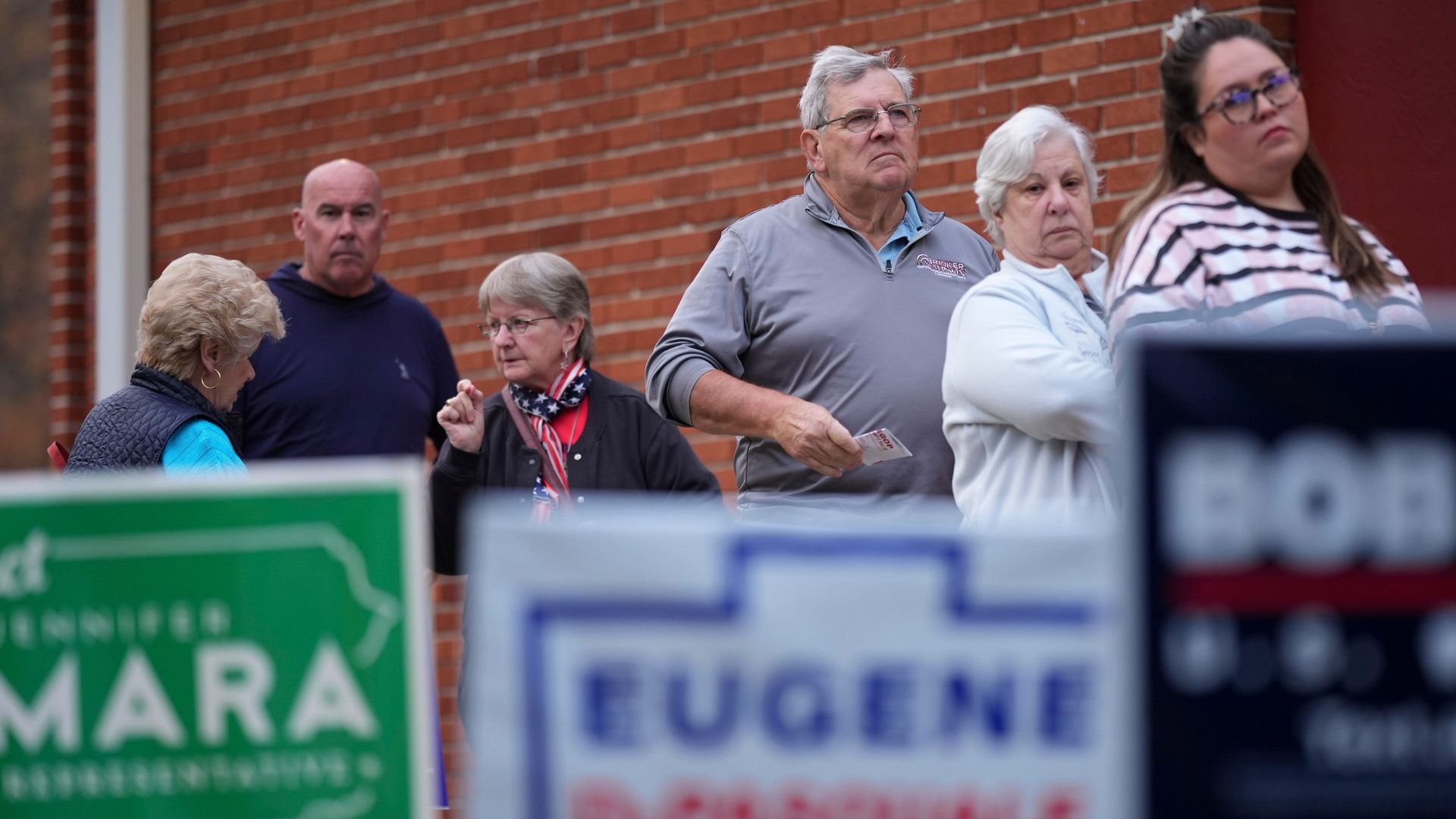 Voters stand in line while waiting for a polling place to open, Tuesday, Nov. 5, 2024, in Springfield, Pa.