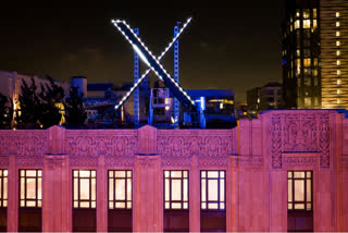 Workers install lighting on an X sign atop the company headquarters, formerly known as Twitter file photo used for news thumbnail