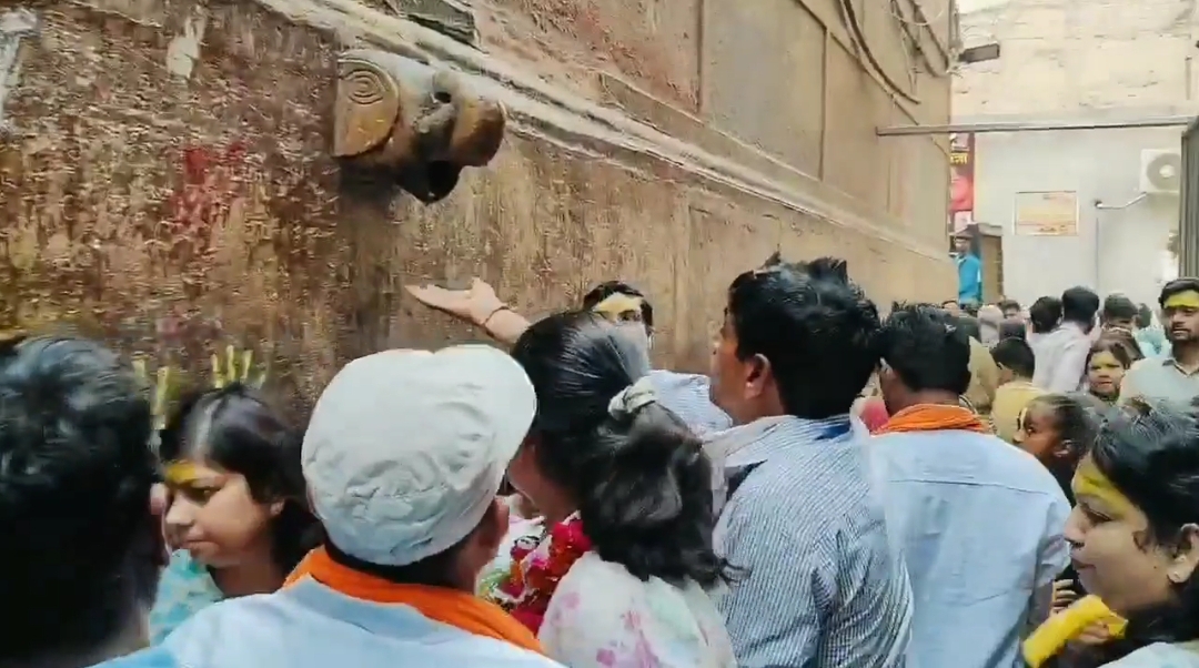 Devotees drink AC water  Believing It To Be  Charan Amrit