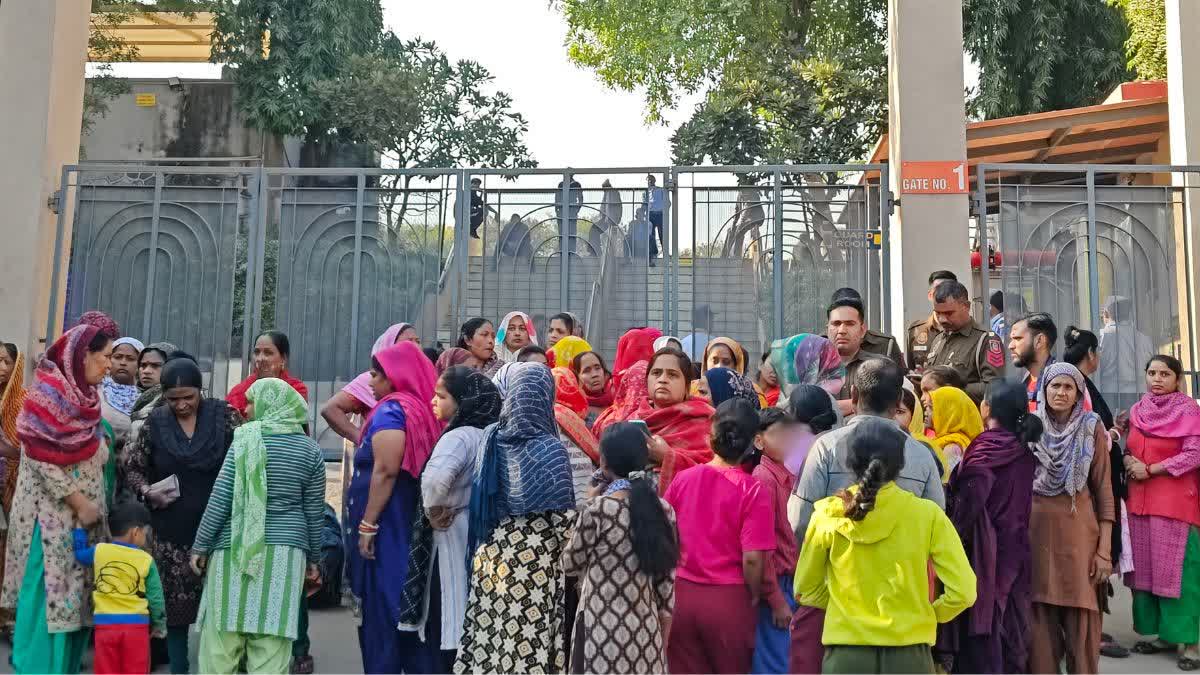 Parents accompanied by locals protest outside a school against the death of a boy during a quarrel in Delhi