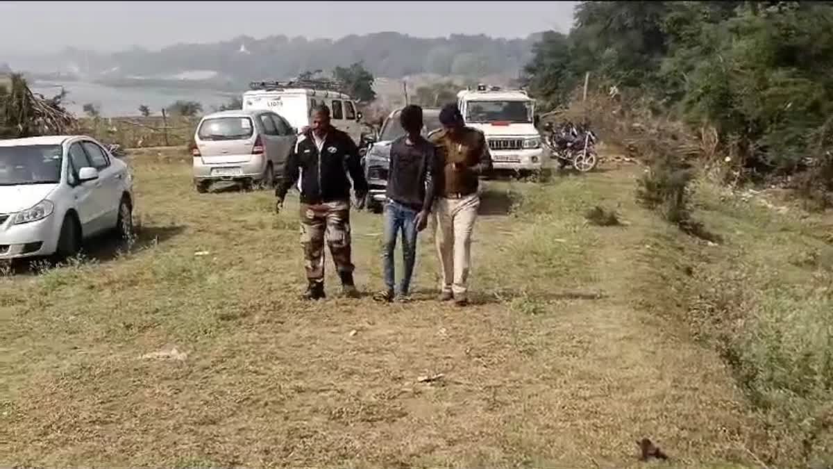 An offender escorted by policemen in Jabalpur, Madhya Pradesh