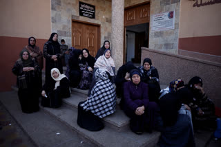 Palestinian women mourn relatives killed in the Israeli bombardment of the Gaza Strip outside a hospital morgue in Khan Younis, Saturday, Jan. 6, 2023. (AP Photo/Mohammed Dahman)